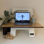 black laptop computer on white wooden desk