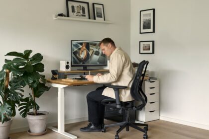 A man sitting at a desk in front of a computer
